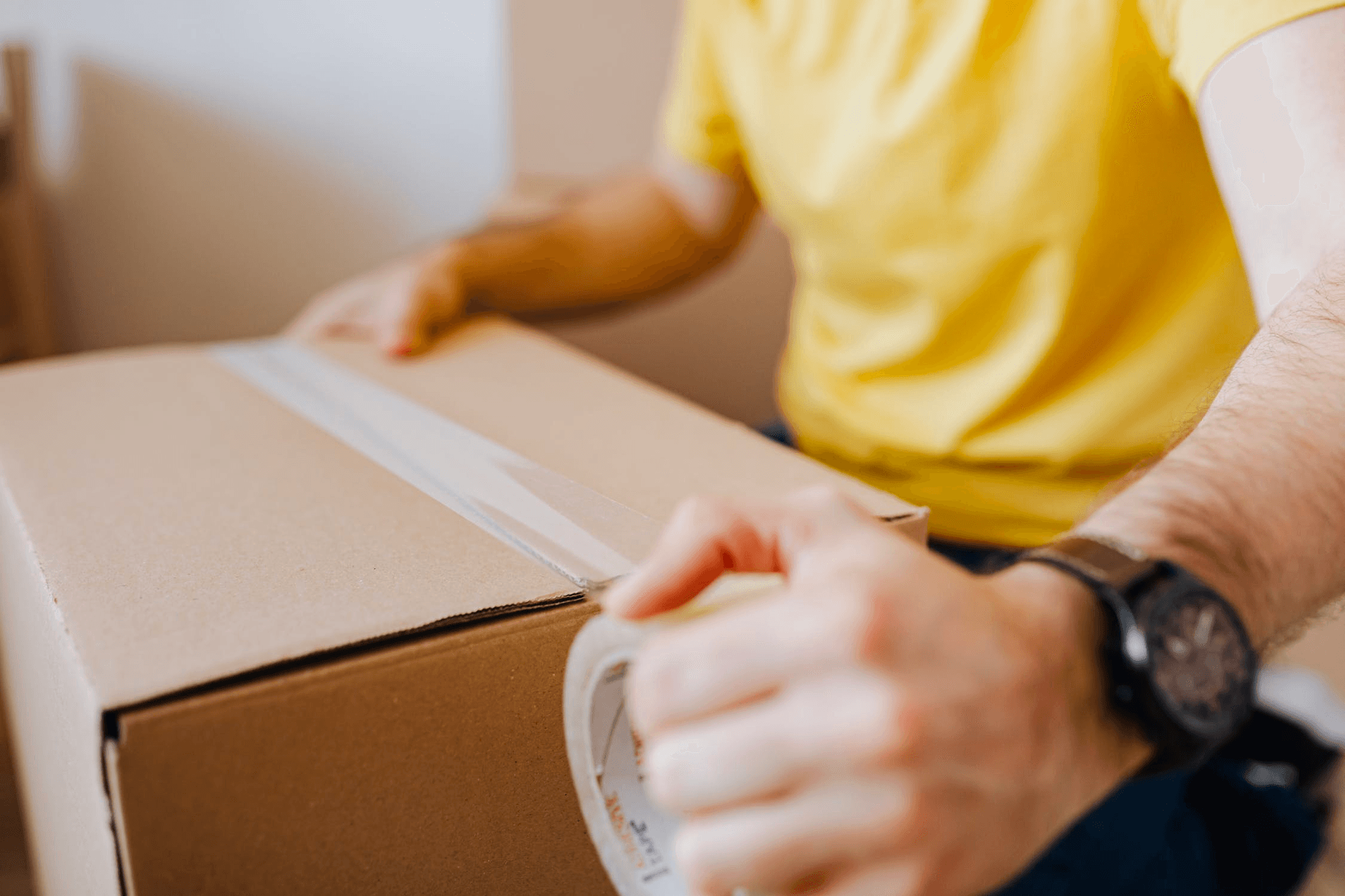 Man packaging a box